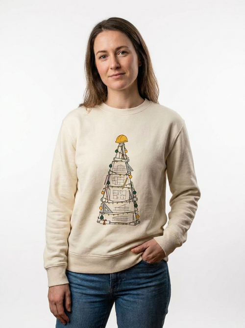 Woman standing in the Building Plans Christmas Tree Jumper, a Christmas tree drawn as building plans
