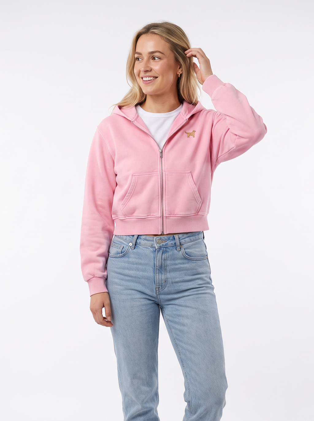 Woman wearing the Pink mineral wash zip hoodie with a small golden retriever on the chest
