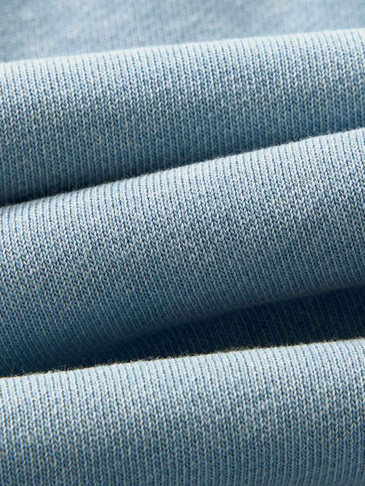 Close-up of the soft Haze Blue mineral wash fabric texture