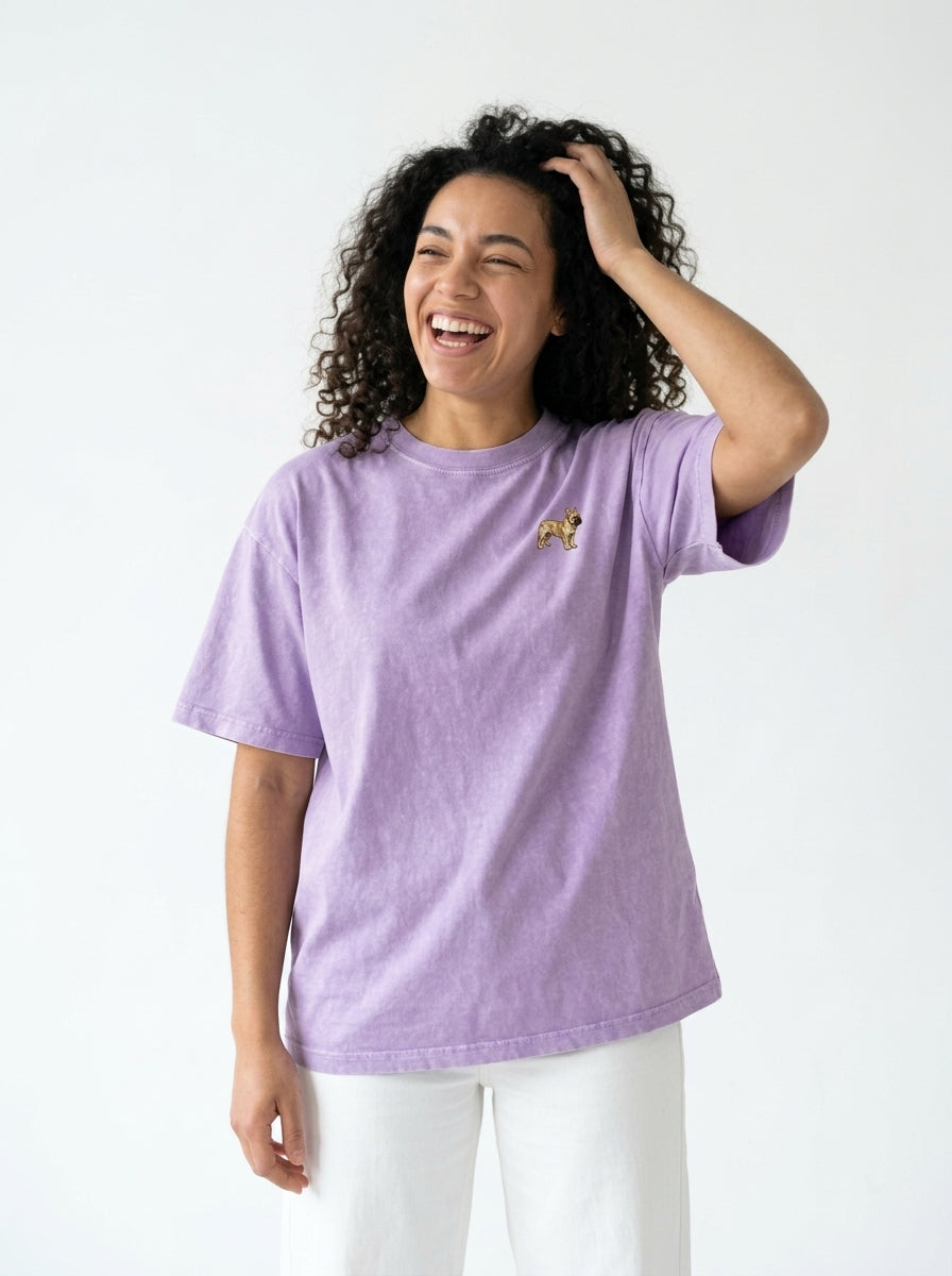 Woman laughing in the Purple boxy mineral wash t-shirt with a small embroidered-look French Bulldog on the chest